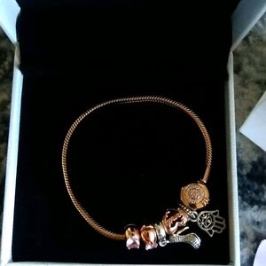 Pandora rose gold bracelet with charms